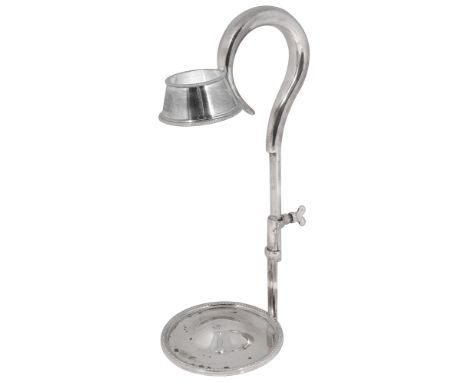 An Edwardian electroplated adjustable bottle holderplain scroll handle, the collar and circular base with beaded borders,cres