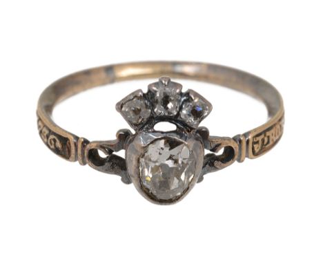 A mid 18th century diamond and enamel memorial ring, the central old brilliant-cut diamond cut-down collet with three stone d