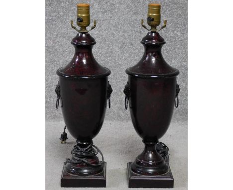 A pair of regency style metal urn lamp bases with lions head handles. Hardstone effect to the metal. H.48cm 