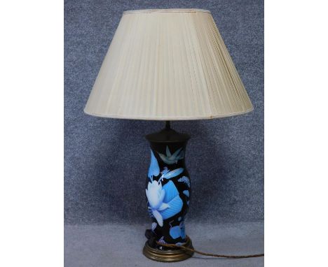 A vintage glass over metal table lamp with tropical flowers, foliage, birds and insects. Including a hummingbird, spoonbill, 