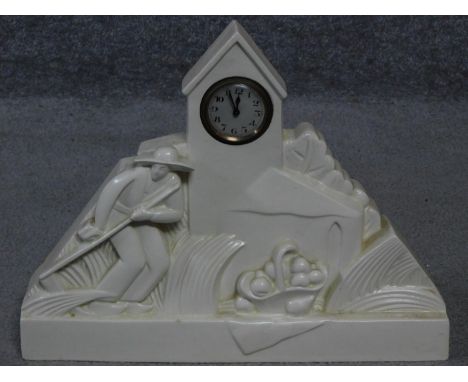 A French Art Deco white ceramic mantle clock signed G. Chevalier to the back for George Chavalier who was a designer for Bacc