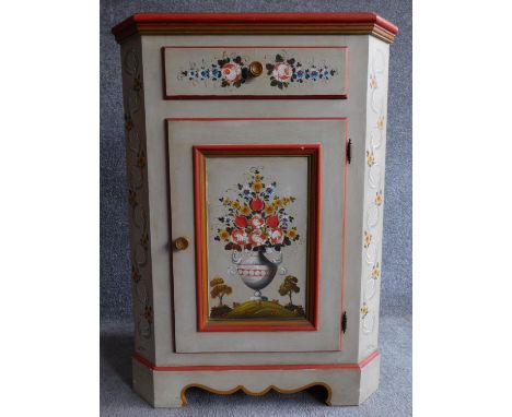 A Continental style hand painted corner cabinet with frieze drawer above panel door on shaped bracket feet. H.92 W.67 D.42cm 