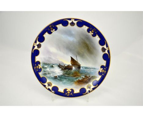 A Royal Worcester cabinet plate, decorated with fishing boats, with a blue and gilt border, signed H. Davis and date code for