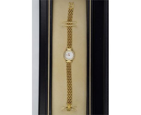 A Chopard ladies 18ct yellow gold classic wrist watch, cream dot dial with diamond set bezel and shoulders, fitted on a match