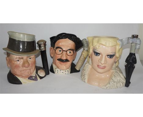 Three Royal Doulton large character jugs, comprising Groucho Marx, Mae West and WC Fields, from the Celebrity Collection. (3)