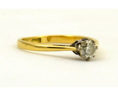 A single stone Diamond ring, 4.4mm round diamond, claw set and mounted in 18ct (stamped) yellow and white gold. Weight approx