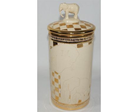 A Dennis Chinaworks trial vase and lid, decorated with elephants and with an elephant finial. Impressed marks. Height 19.5cm.