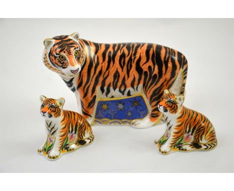 Three Royal Crown Derby paperweights, a Siberian Tiger, limited edition 518/750 and two Sumatran Tigar Cubs. All with gold st