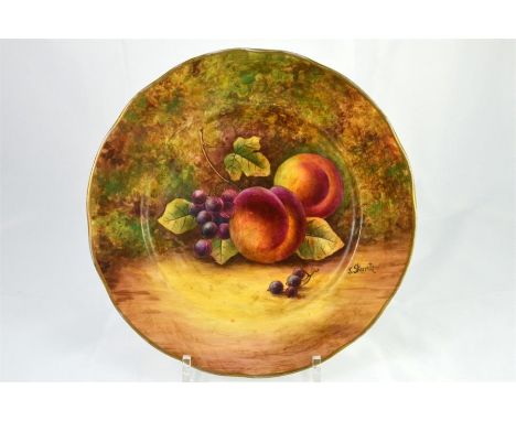 An after Royal Worcester plate with fruit decoration, signed J. Skerrett. Printed marks. Diameter 26cm.