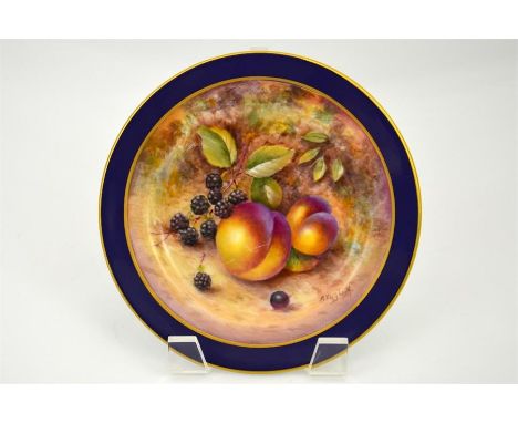 A Royal Worcester plate, with a gilt and blue border and fruit decoration, signed R English. Date Black mark. Diameter 16.5cm