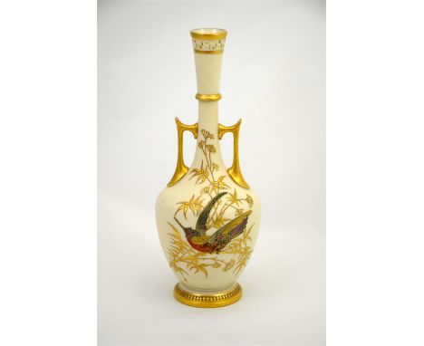 A Royal Worcester reticulated vase, decorated with a gilded bird. Date code for 1887. Height 25.5cm.