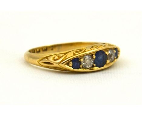 A five stone sapphire and diamond ring, centre sapphire approx 3mm round, two shoulder sapphires approx 2mm round. With two o