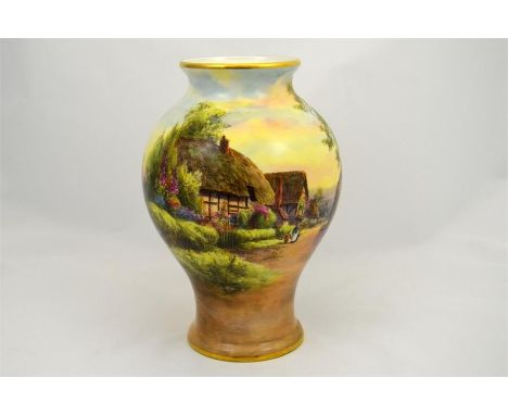 A Royal Worcester vase decorated with a village scene and titled Little Comberton. Signed C. Creese. Circa 1916. Height 25cm.