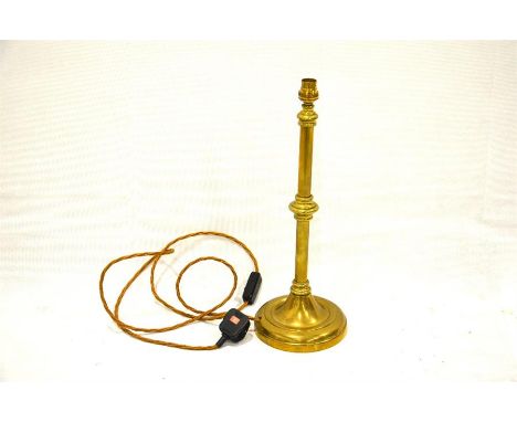 A 20th century weighted brass lamp. Height 46cm.