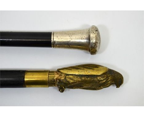 A silver topped walking cane, Ebenezer Newman & Co. London. Circa 1900. Also a brass topped Russian eagle sword stick. Length