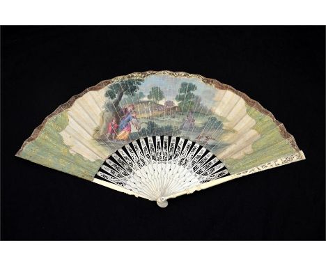 λ An 18th century ivory fan, with pierced and carved ivory sticks and guards. The guards with carved flowers, birds and urns.