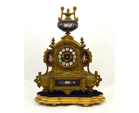 A clock with Sevres style porcelain plaques and the dial decorated with a floral pattern and Roman numerals. Mounted on a sep