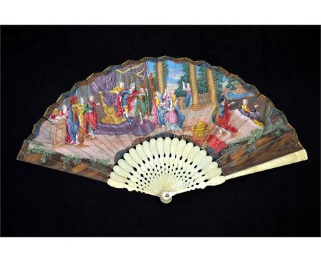 λ An early 18th century ivory fan, with carved ivory sticks and guards, the guards with figures in period dress and each stic