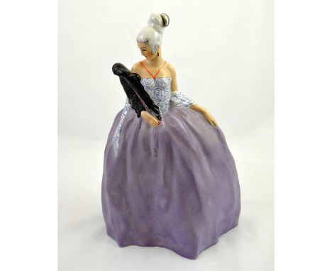 An art deco ceramic figure of a women in a ballgown for Editions Etling, France. Circa 1930's. Printed marks. Height 35cm.