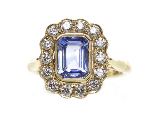EIGHTEEN CARAT GOLD SAPPHIRE AND DIAMOND RINGset with a step cut sapphire of approximately 1.75 carats, surrounded by round b