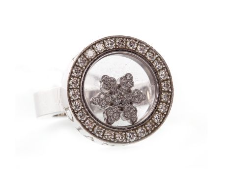 CHOPARD HAPPY DIAMONDS EIGHTEEN CARAT WHITE GOLD SNOWFLAKE MOTIF RINGwith a circular bezel 17mm diameter with a central cryst