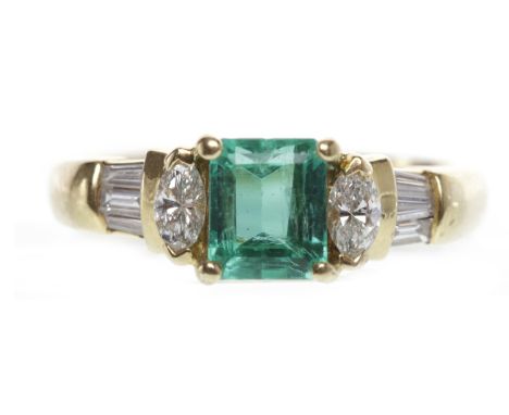 EIGHTEEN CARAT GOLD EMERALD AND DIAMOND RINGset with a step cut emerald of approximately 1.00 carat, flanked by two marquise 