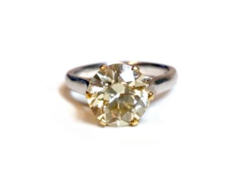 IMPRESSIVE CERTIFICATED YELLOW DIAMOND SOLITAIRE RINGwith a six claw set old round brilliant cut diamond of 3.87 carats with 