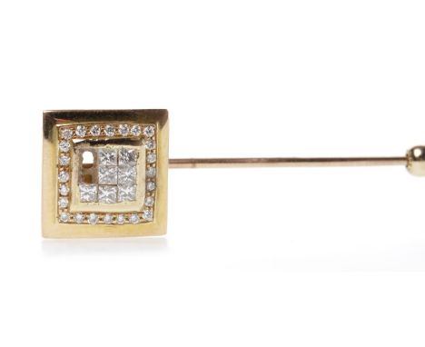 DIAMOND SET TIE PINwith a square terminal 12mm across with channel set princess cut diamonds surrounded by grain set round di