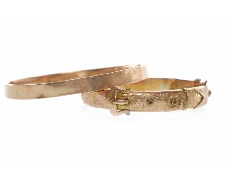 EARLY TWENTIETH CENTURY NINE CARAT GOLD ARMLETof circular form, 79mm to outer edge, 11.7g; along with a late Victorian nine c