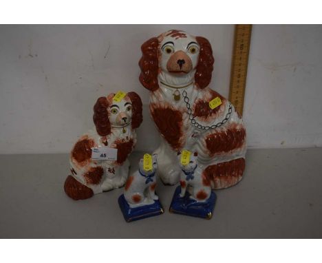 Mixed Lot: Pair of Staffordshire style model cats, (later copies) together with two further Staffordshire Spaniels