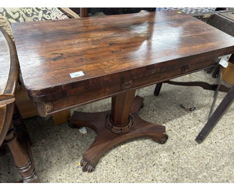 An early Victorian rosewood card table with platform base
