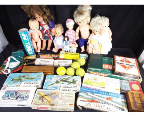 A good mixed lot to include dolls, board games, dominoes, table tennis set and six model kits, four  Airfix and two by Impact