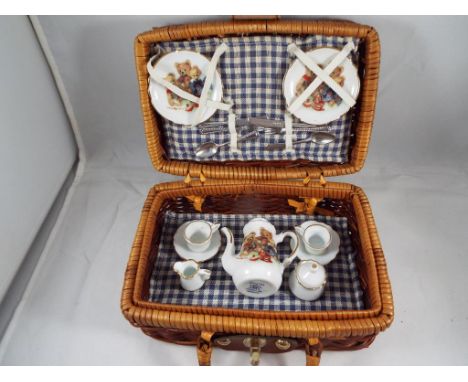 Dolls House Accessories - a Reutter porcelain picnic set featuring The Unique Bear Henry print consisting of a two place sett