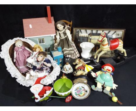 A good mixed lot to include miniature ceramic dolls, a wooden rocking horse, a wooden house, an animated wooden clown, cerami