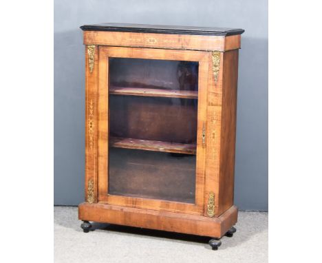 A Late Victorian Walnut and Gilt Metal Mounted Dwarf Display Cabinet, with ebonised moulded edge to top, the frieze inlaid wi