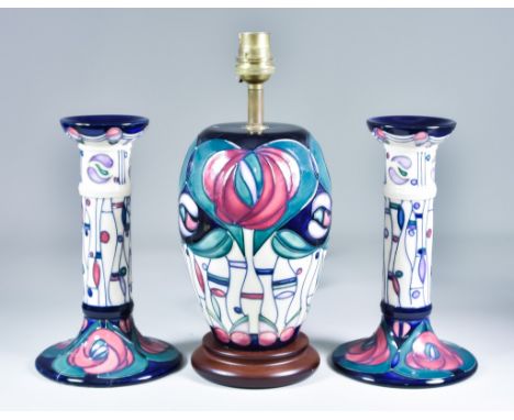 A Pair of Moorcroft Pottery Candlesticks and a Moorcroft Pottery Table Lamp, decorated in Mackintosh Tribute pattern, the can