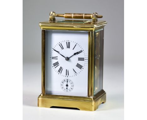 A Late 19th/Early 20th Century Brass Cased Carriage Clock, the white enamel dial with Roman numerals and subsidiary minutes d