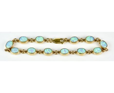 A 9ct Gold Custom Made Opal Line Bracelet, Modern, set with twelve opal stones,  approximately 9mm x 7mm each, 210mm overall,