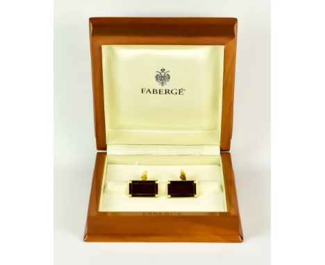A Pair of 18ct Gold Enamel and Diamond Cuff Links, by Fabergé, set with black and red enamelled panels with four small diamon