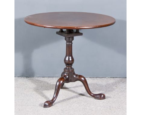A George III Mahogany Circular Tripod Occasional Table, with plain top on turned central column with birdcage and cabriole le