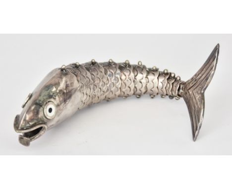 A Mexican Los Castillo Articulated Fish Bottle Opener, with black and white enamel eyes, 8.25ins overall
