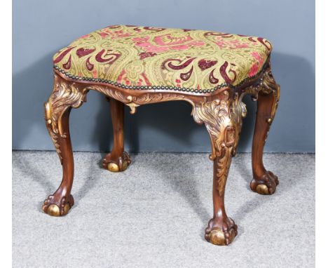 A 20th Century Mahogany and Parcel Gilt Stool, of serpentine outline, the top upholstered in tapestry cloth and studded, on s
