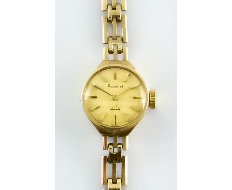 A 9ct Gold Lady's Manual Wind Wristwatch, by Acurist, 15mm diameter case, champagne dial with gold baton numerals, integral 9