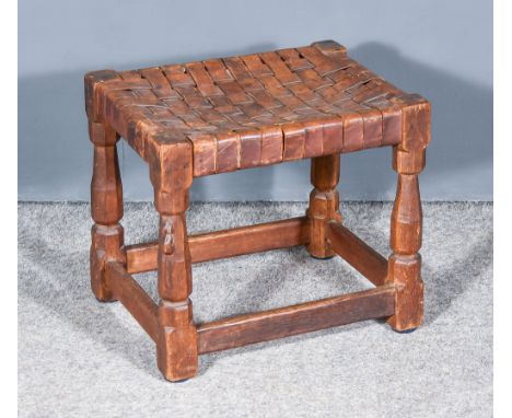 A Robert "Mouseman" Thompson Oak Stool, circa 1930s, with brown leather latticed seat on turned octagonal supports, one carve