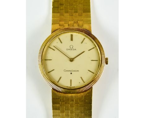 An 18ct Gold Gentleman's Manual Wind Wristwatch, by Omega, model Constellation, 32mm diameter case, champagne dial with gold 