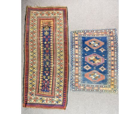 A 20th Century Runner of Kazak Design, woven in colours, the field filled with stylised floral and geometric motif within con