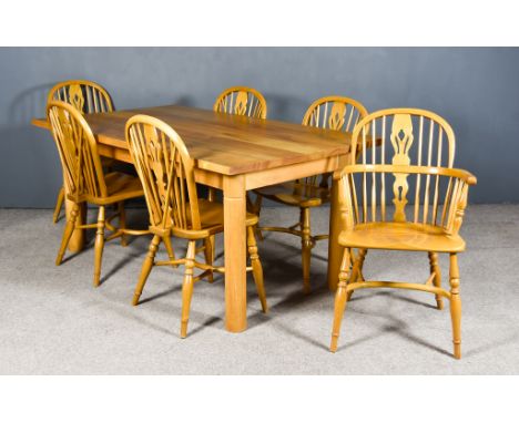 A Modern Light Oak Refectory Table, the seven plank top with square edge, and on turned legs, 64ins wide x 38ins deep x 30ins