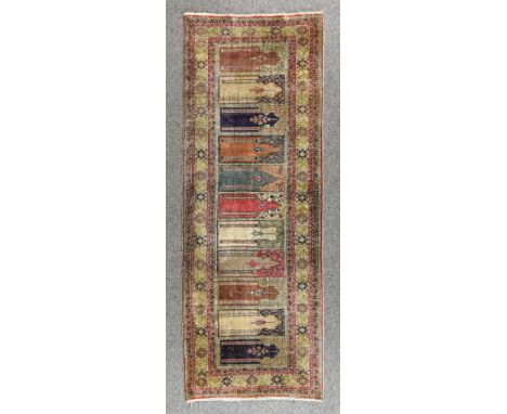 A 20th Century Bakhtiyari Silk Runner of Trellis Design, woven in colours of ivory, navy blue and wine, the field filled with