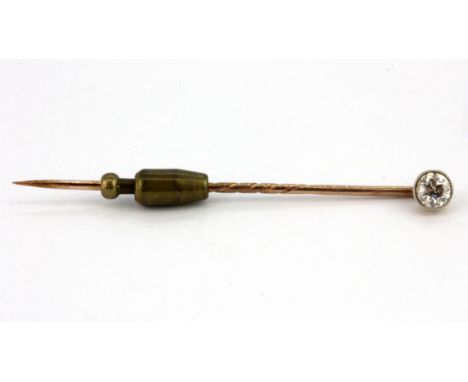 A boxed antique rose metal (tested 9ct gold) stick pin set with a brilliant cut diamond, L. 6cm.