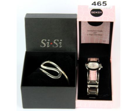 A boxed SiSi bangle with a Seksy wrist watch.